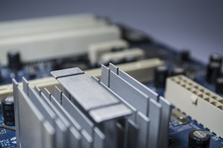 Texture. Background. Modern computer technologies. The old multi-colored motherboard with dust. Electronics.の写真素材