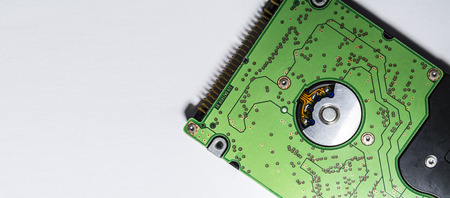 Winchester of green color. Hard drive. Motherboard. Computer spare parts. Memory card. Diskette. On...
