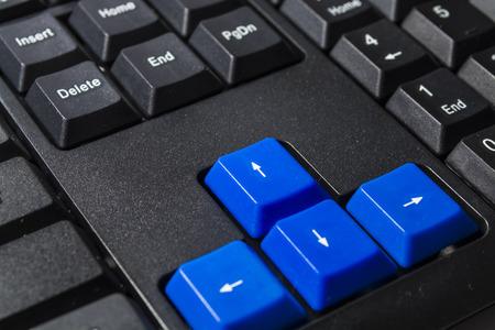 The black computer keyboard with colored buttons. Buttons close up. Modern equipment. Computer. Background and texture. Technologies. Work at office.の写真素材
