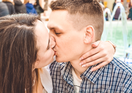 The young married loving couple embraces and kisses. Love and relations. Emotions.の写真素材