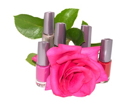 a set of multi-colored nail polish with flower roses isolated on a white backgroundの写真素材