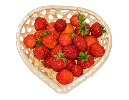 fresh strawberries in a basket isolated on a white backgroundの写真素材