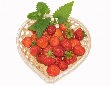 fresh strawberries in a basket isolated on a white backgroundの写真素材