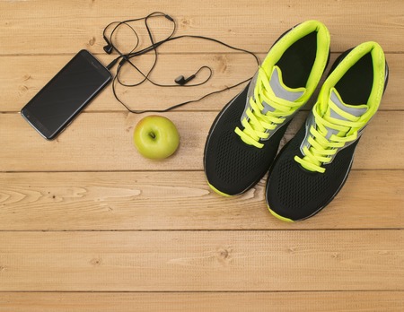 Sports accessories for fitness on the wooden floor. Healthy lifestyle concept.