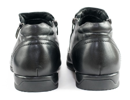 Black men's shoes from leather isolated on white background. Shoes for the autumn weather.の写真素材