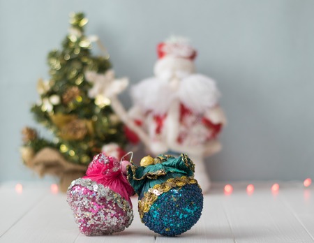 Beautiful toy on the background of the Christmas tree and Santa Claus. Meeting Christmas and New...