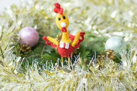 Toy rooster on a wooden table. Meeting Christmas and New Year.の写真素材