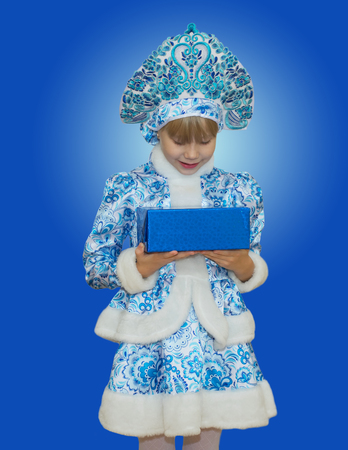 beautiful little girl in suit Snow Maiden. New Year and Christmas. Beautiful gift.の写真素材