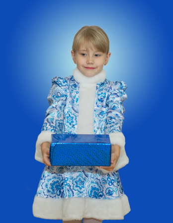 beautiful little girl in suit Snow Maiden. New Year and Christmas. Beautiful gift.の写真素材