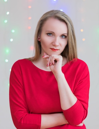 Beautiful woman on the background of colored lights. Portrait of a woman.の写真素材