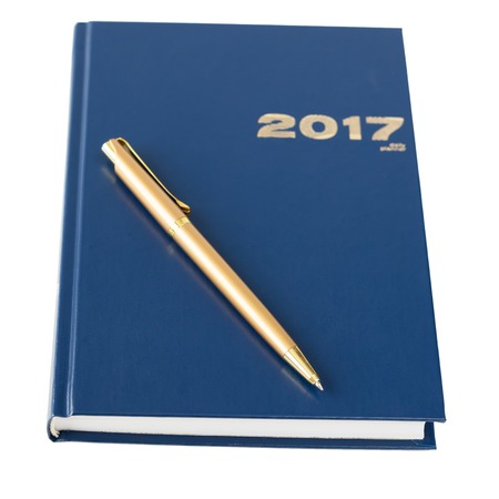 Blue notebook with a gold pen isolated on white background. Business accessories.の写真素材