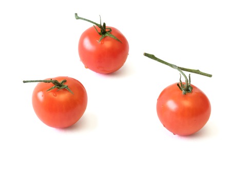Fresh cherry tomatoes isolated on white background. Raw food for a healthy diet.の写真素材