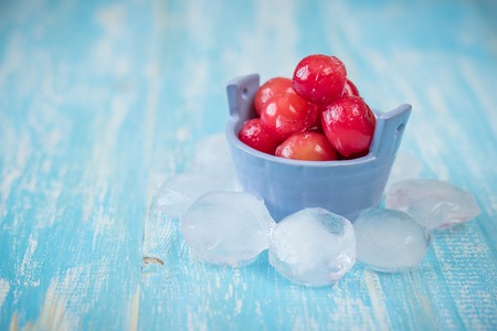 Frozen berries cherry on vintage wooden table. Diet Healthy Eating.の写真素材