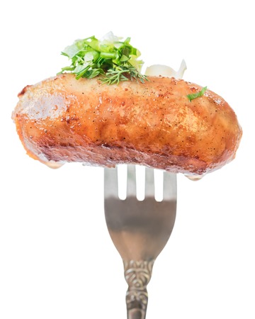 Home sausage fried in oil on a fork. Sausage isolated on white background.の写真素材