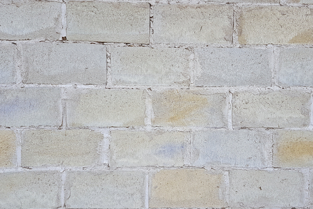 The view of the wall is made up of large gray concrete blocks. Background of a brick wall.の写真素材