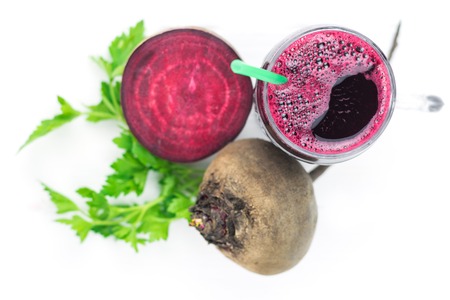 Beet smoothie with grapefruit and parsley on wooden table top view. The concept diet food for weight loss.の写真素材