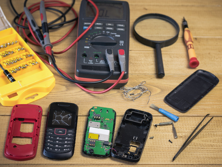 Spare parts and tools for repair of your mobile phone. The concept of mobile phone repair.の写真素材
