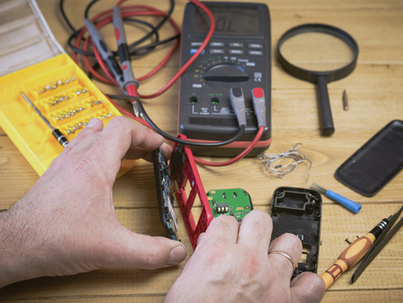 Spare parts and tools for repair of your mobile phone. The concept of mobile phone repair.の写真素材