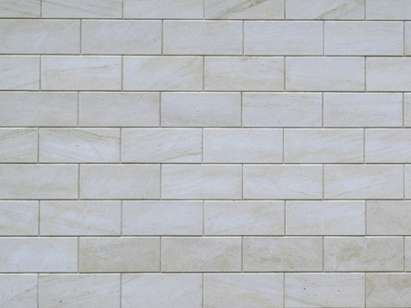 Gray wall made of large cement blocks. Background of gray brick wall.の写真素材