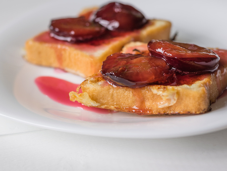 Toasted French bread with curd cream and plum jam. The concept of organic Breakfast. Diet.の写真素材