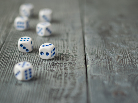 Dice blue and white color on wooden rustic table. Accessories for Board games.の写真素材