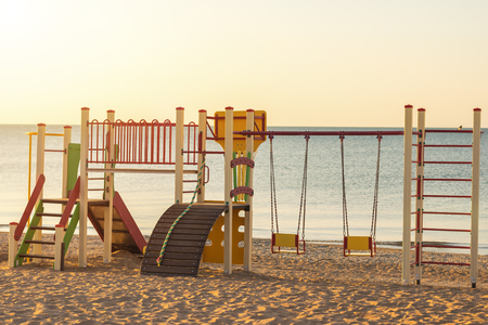 Colorful swing with slide for children on the beach.の写真素材