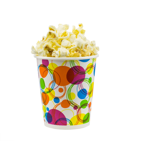 Popcorn in multi-colored festive glass isolated on a white background.の写真素材