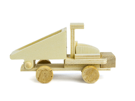 Wooden dump truck model isolated on white background. Side view.の写真素材