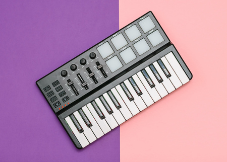 Musical mini mixer on a background of two colors. Equipment for the music Studio. The view from the top. Flat lay.の写真素材
