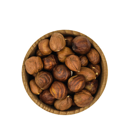 Wooden bowl with hazelnuts isolated on white background. Natural diet vegetarian food. The view from the top.の写真素材