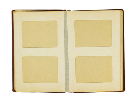 Old uncovered photo album with red cover isolated on white background. Flat lay The view from the top.の写真素材