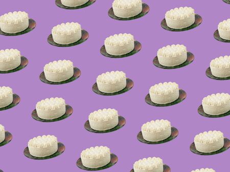 A large number of cakes on a plate on a lilac background. The pattern of fresh pastries. Collage.の写真素材