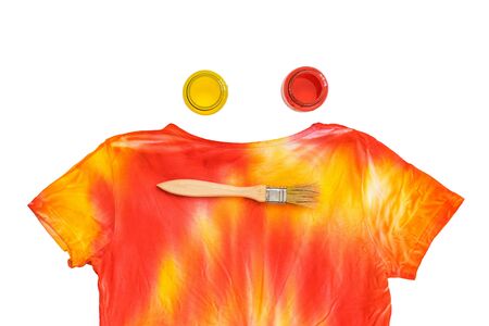 Cans of paint, brush and t-shirt in tie dye style isolated on white background. Staining fabric in tie dye style.の写真素材