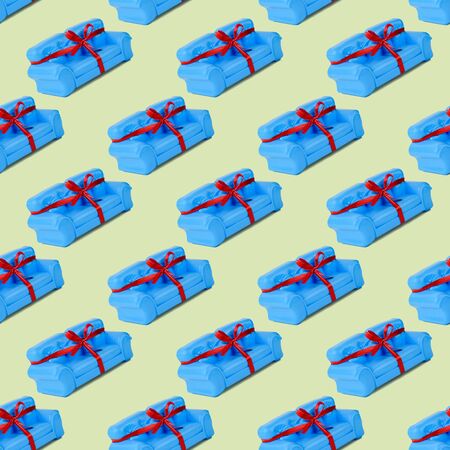 Seamless pattern of blue sofas with red ribbon. A sample of beautiful furniture for the house. Minimalist.の写真素材