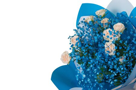 Bouquet with yellow roses and small blue flowers isolated on a white background. A gift for a woman. Festive mood.の写真素材