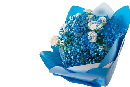 Beautiful and bright blue bouquet with roses isolated on white background. A gift for a woman. Festive mood.の写真素材