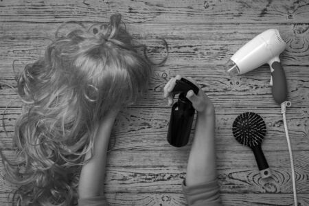 Black and white image of wig spray treatment for hair. Accessories for creating style and hair care.の写真素材