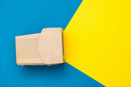 Vintage monitor on blue and yellow background. Imitation of the beam from the screen. Vintage...
