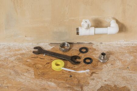 A damaged heating system faucet protruding from the wall. Accident of the heating system of a private house. Heating radiator.の写真素材