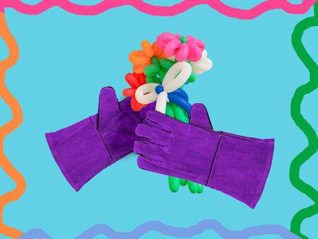 Two welder's gloves and a bunch of balloons. Collage of modern art.の写真素材