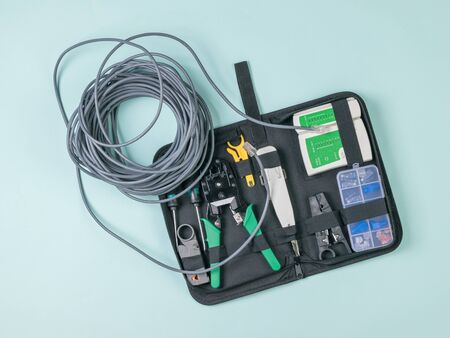 Utp cable and tool kit on a light background. Connection to the Internet.