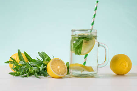 Lemon fruit, a Cup of water, peppermint and lemon. The concept of a healthy lifestyle.