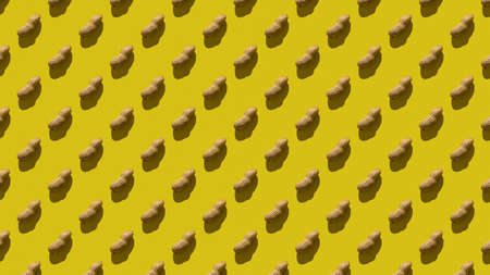 Seamless pattern of a large number of peanuts on a yellow background. Dry roasted peanuts.の写真素材