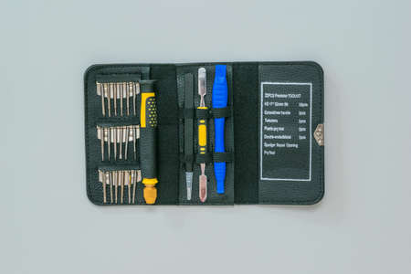 A set of tools for repairing smartphones on a light background. Mini tool in the case.の写真素材
