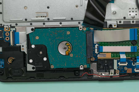Open laptop case on a blue background. Repair and restore laptop performance.