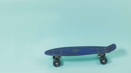 Blue skateboard on a light blue background. Board for skiing.の写真素材