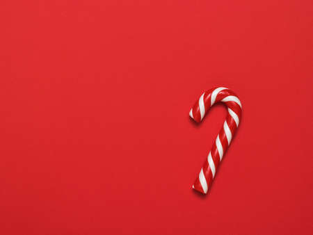 Red and white Christmas sweetness on a bright red background. Meeting of Christmas and new year.