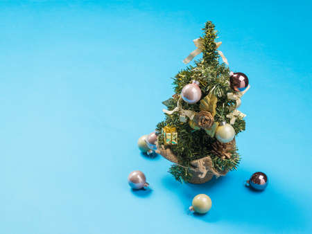 Top view of a Christmas tree on a blue background. Meeting of Christmas and New year.
