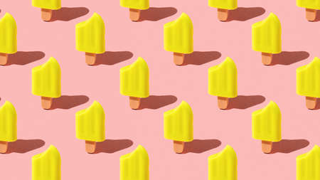 A pattern of yellow ice cream bitten on a red background. A popular summer snack.の写真素材
