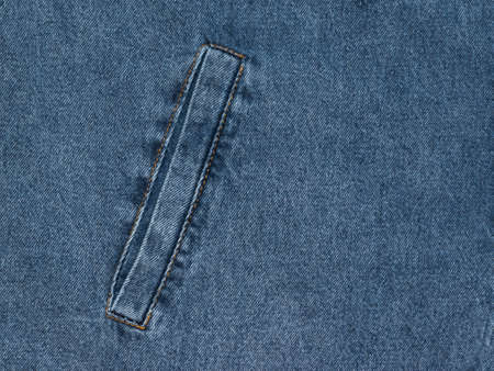 Blue denim background with a sewn-in inside pocket. Popular fabric.